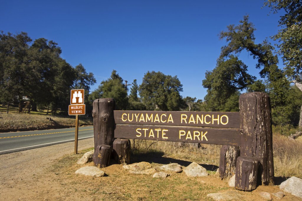 Along Highway 79 in Southwest California, USA, the entrance sign to Cuyamaca Rancho State Park in East San Diego County welcomes visitors to a haven of natural beauty, boasting rugged landscapes and diverse flora and fauna.